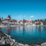 a body of water with a bunch of buildings in the background
