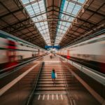 white and red train in tunnel