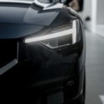 a black car is parked in a garage